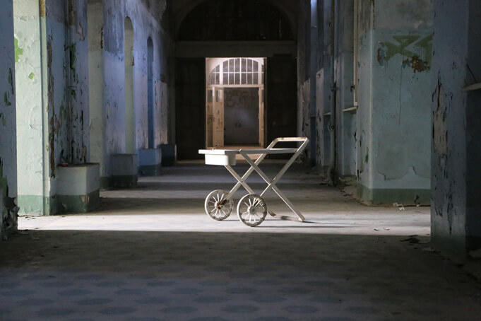 A hallway at the Beelitzer Sanatorium. Source.