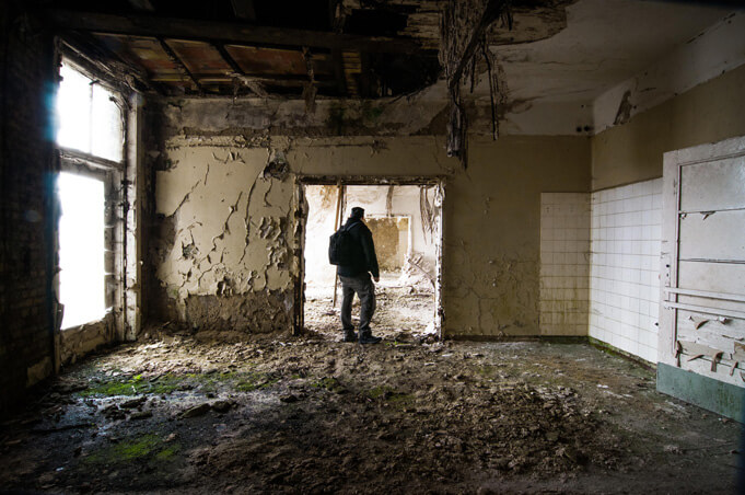 Exploring the rubble at Hohenlychen. Source.