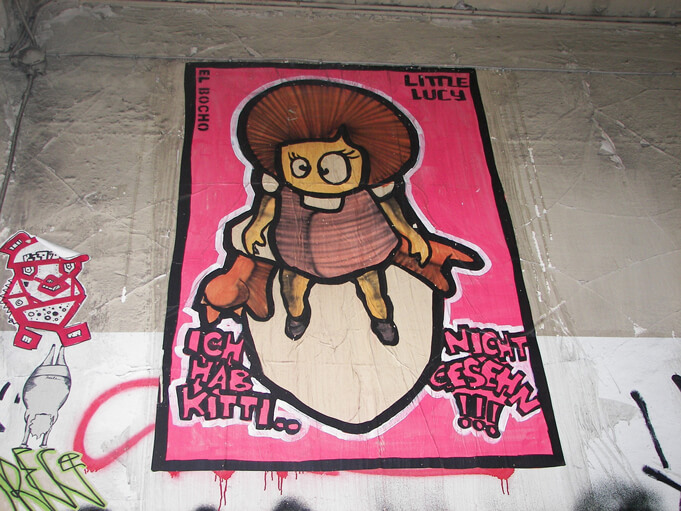 Berlin Street Art: El Bocho's character "Little Lucy" is frequently depicted in his designs. Source.